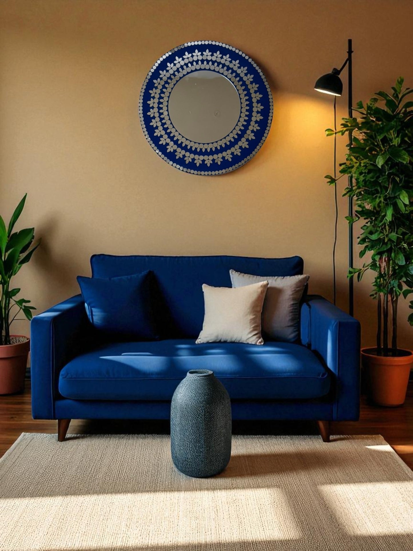 The Midnight Blossom mosaic mirror is mounted above the sofa, reflecting natural light.