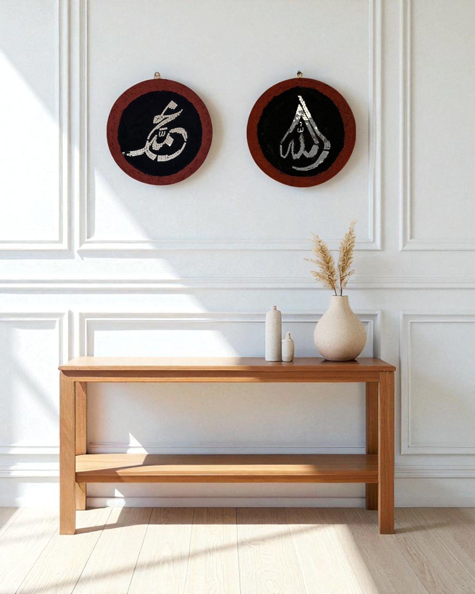 Two round Islamic calligraphy mosaic mirror wall art pieces on a white paneled wall in a Scandinavian living room with a wooden console and neutral decor.