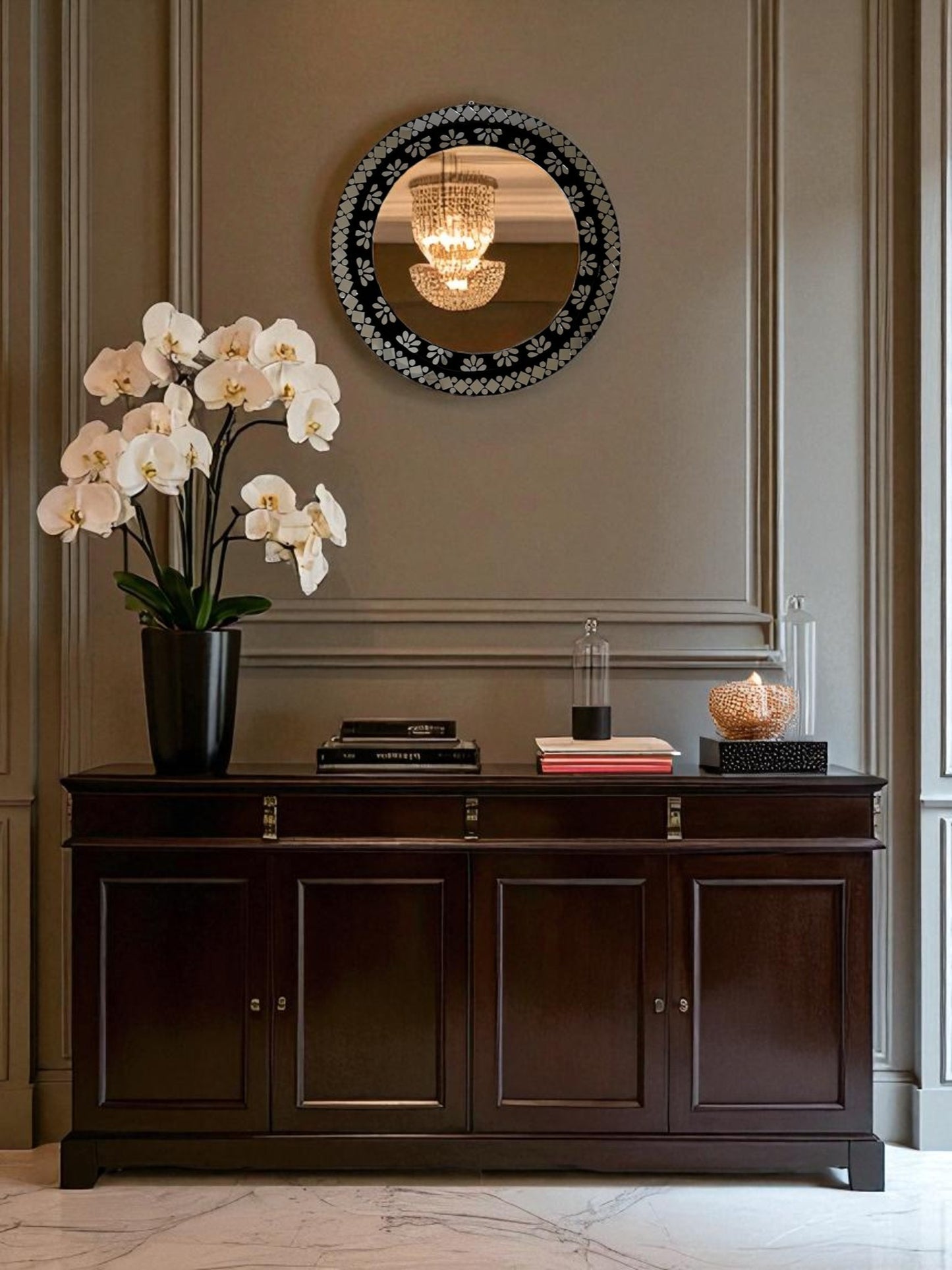 Elegant black floral mosaic mirror styled in a luxury entryway with dark wood and brass decor elements.