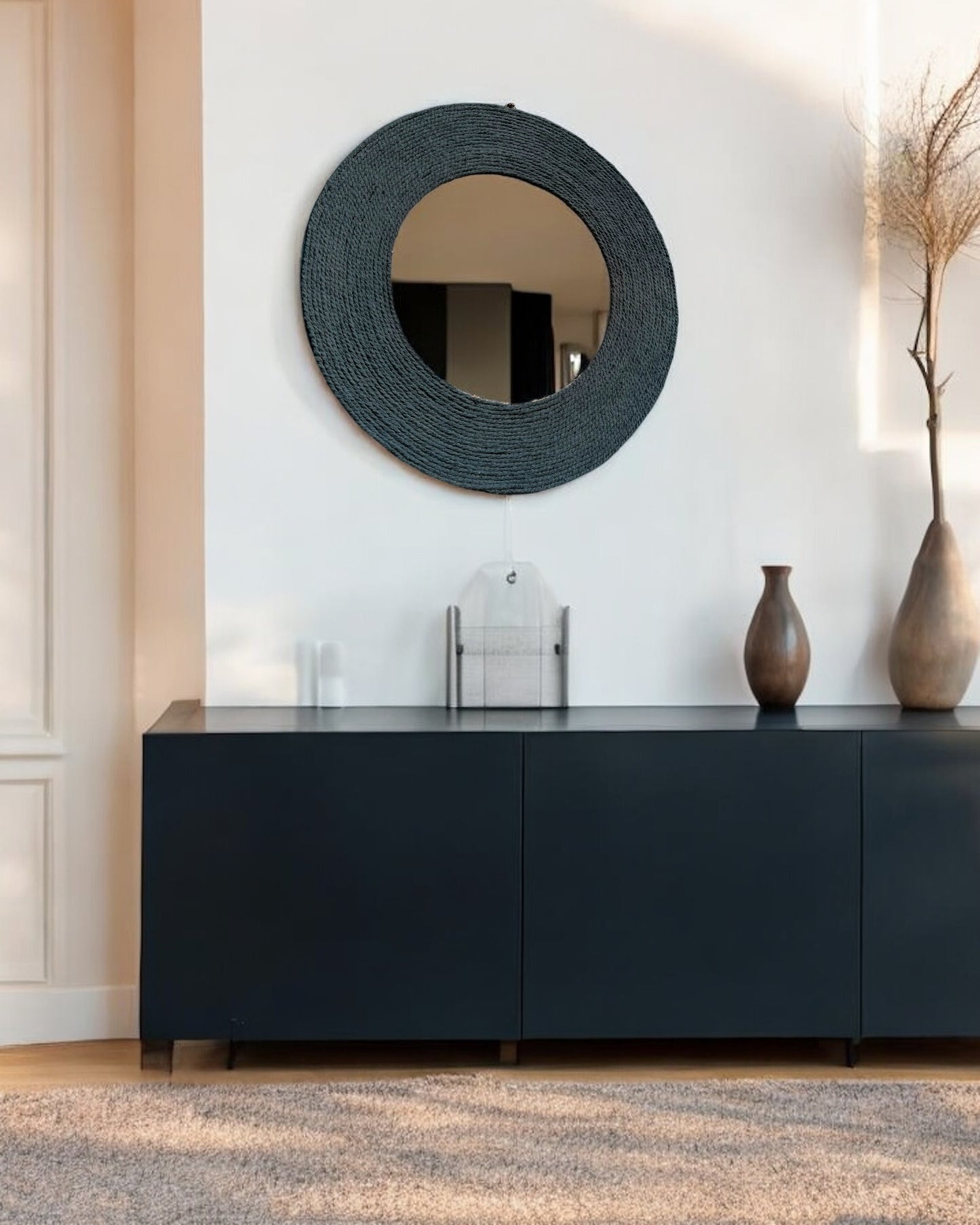 Blue Haze mirror hanging on light wall with dark console table for elegant modern decor