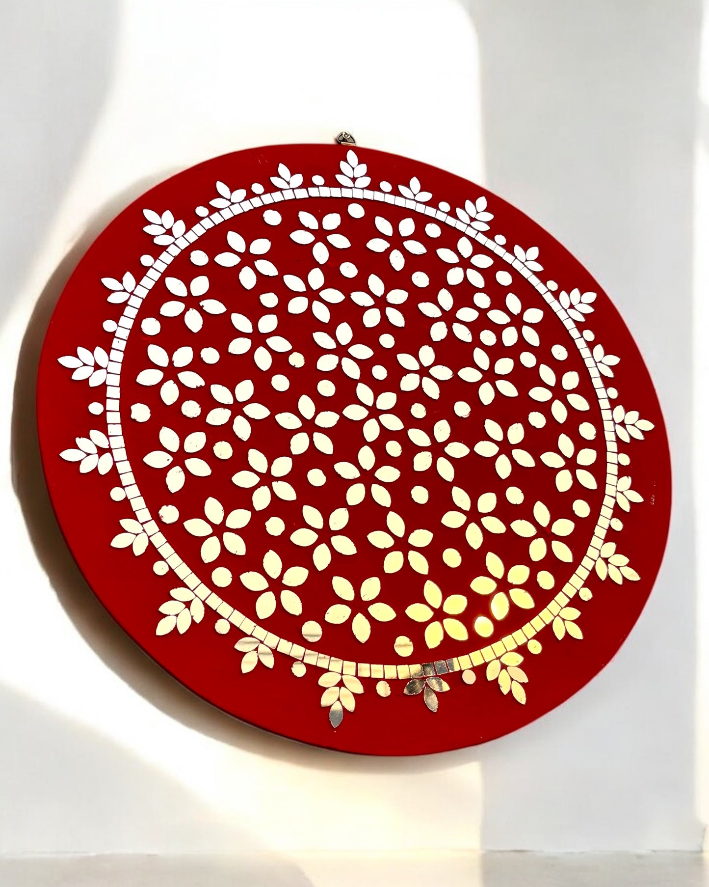 Close-up view of red floral mirror mosaic design by Mirroza showing intricate handcrafted tiles