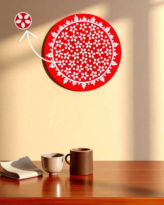 Mirroza crimson bloom and white circular wall art on a beige wall with two cups on a wooden surface.