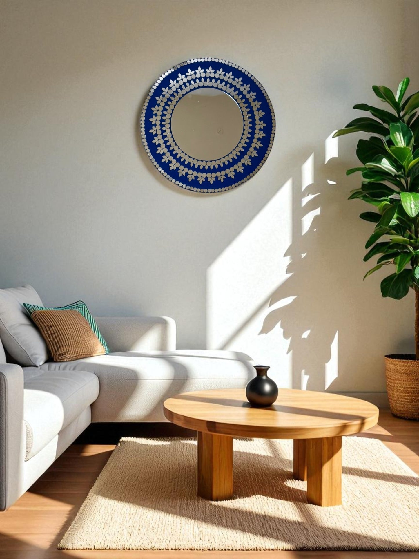 Midnight Blossom handcrafted mosaic round mirror styled in a modern living room with pure white wall, indoor plants, and neutral décor