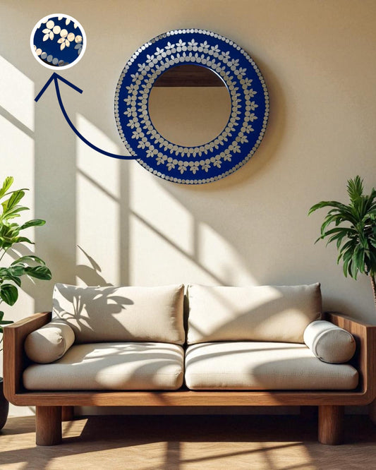 Sofa in a room with a mirroza's decorative midnight bloom round mosaic mirror on the wall