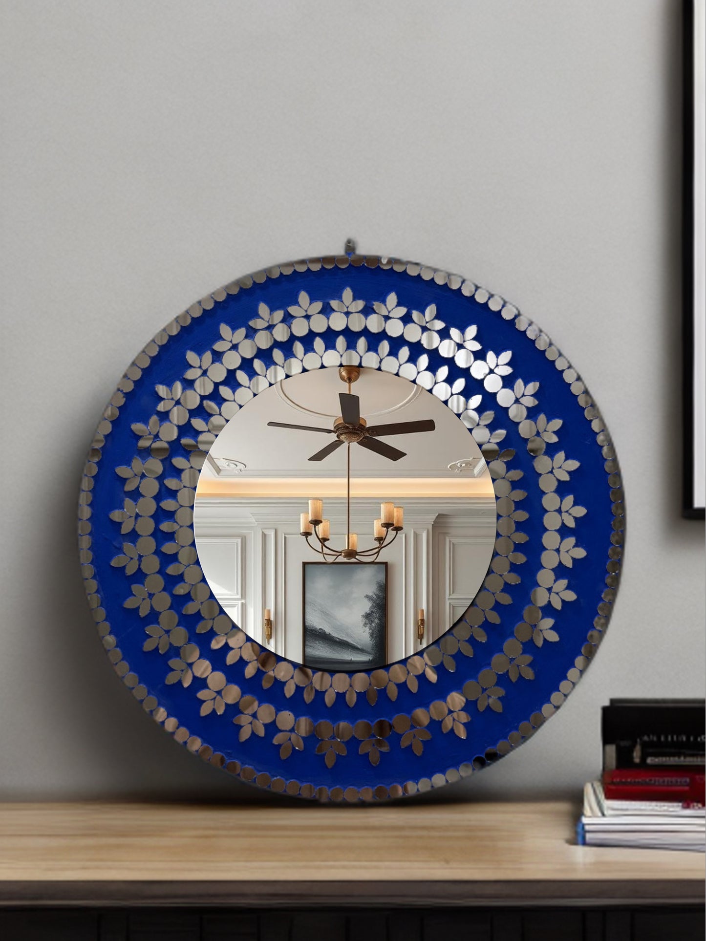 Front view of Midnight Blossom handcrafted round mosaic wall mirror with navy base and reflective glass floral design
