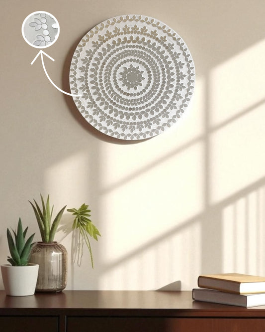 Mirroza white bloom mirror mosaic wall art with floral pattern on a beige wall above a wooden desk with plants and books.