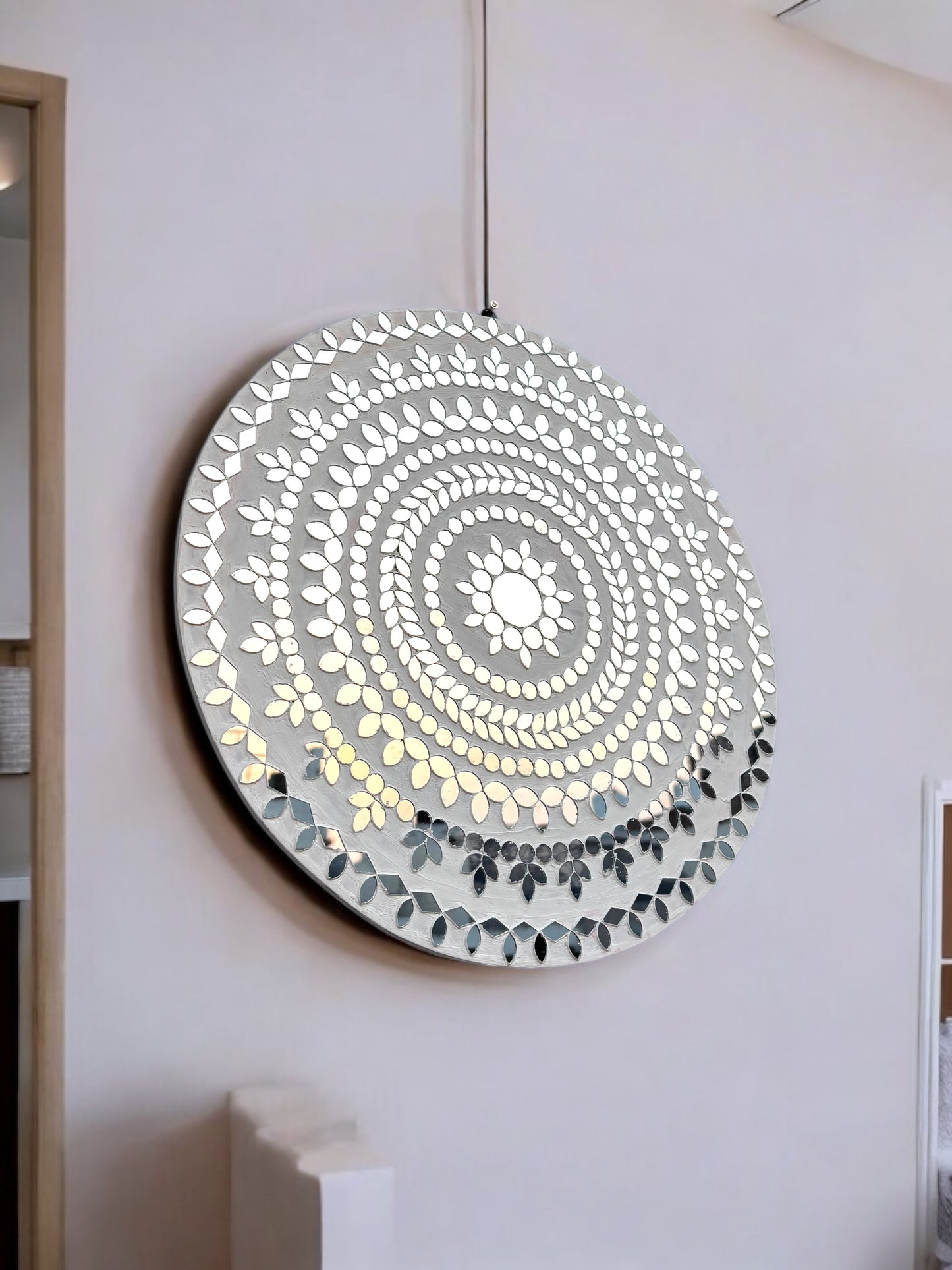 close-up view of white handcrafted mosaic mirror art with floral pattern by Mirroza