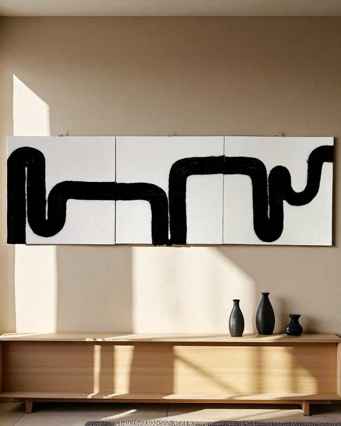 Close-up view of a black rope abstract art panel showcasing detailed rope work and textured surface on a light beige base.