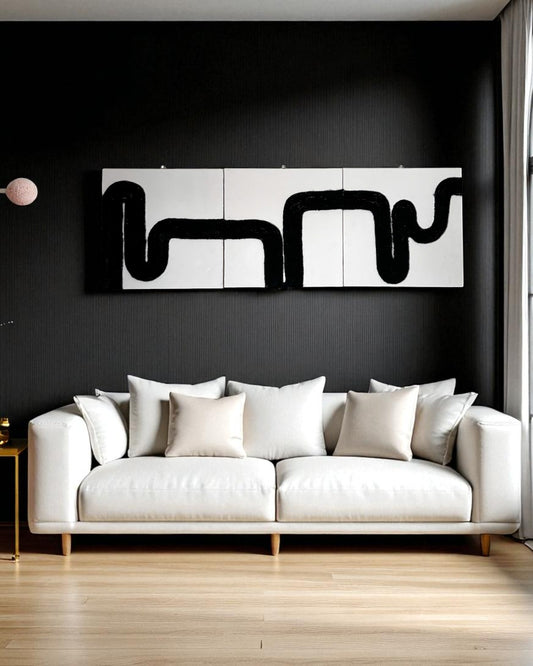 Rope wall art set on dark charcoal wall in elegant living room with emerald sofa and moody lighting