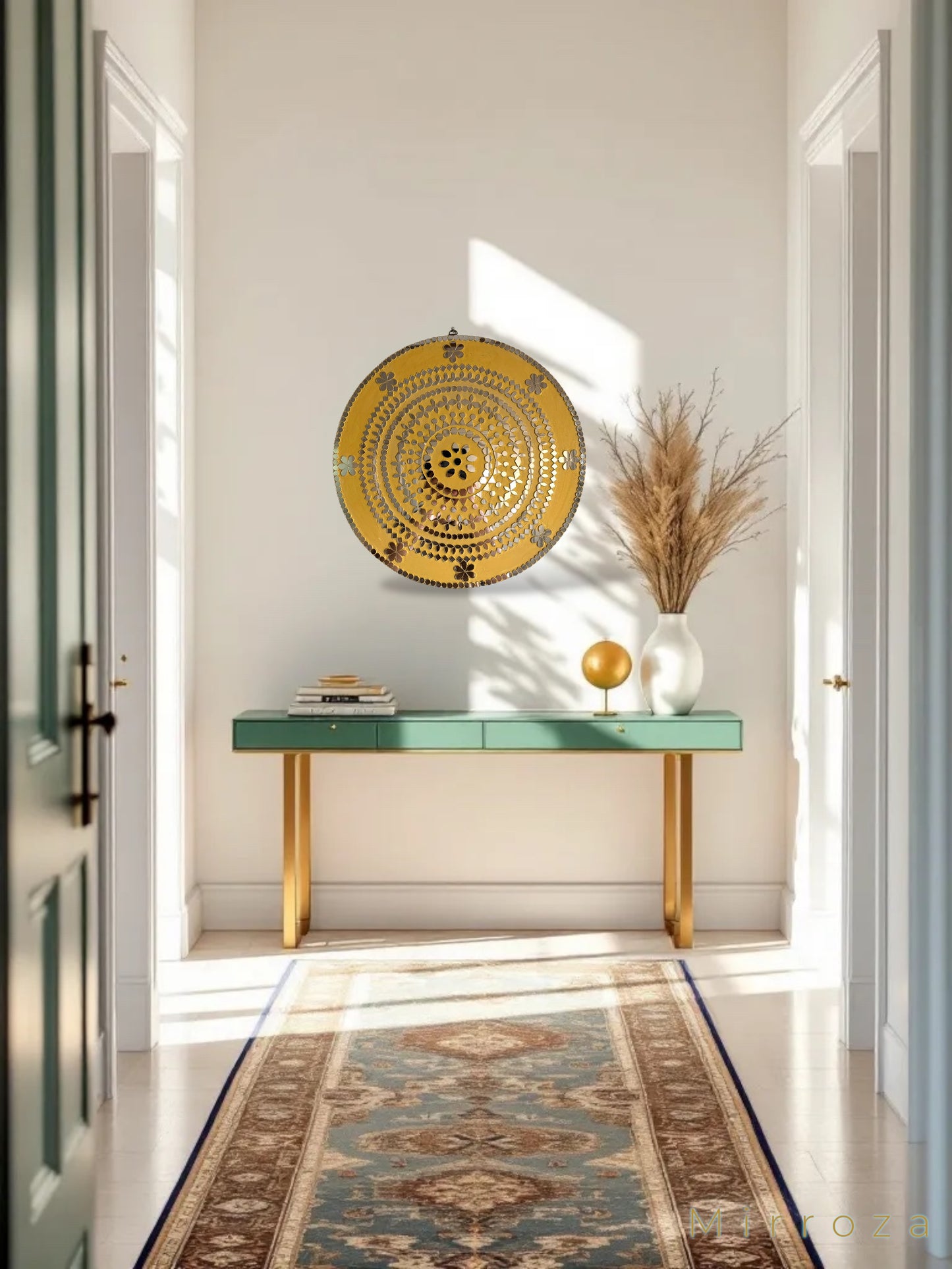 Yellow round floral mirror wall art in a modern entryway above a green console with natural decor