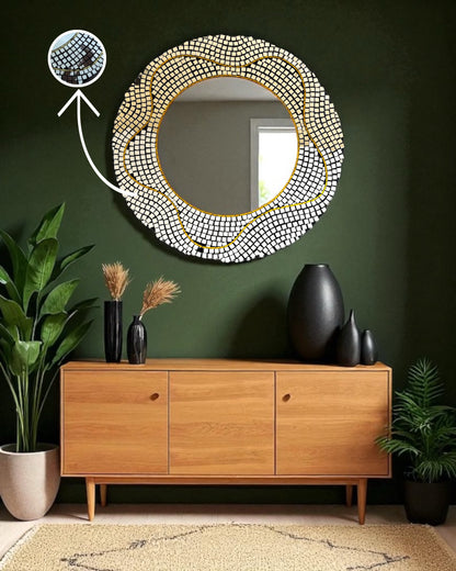 Round mirror mosaic decorative mirror with a gold accent on a green wall above a wooden cabinet.