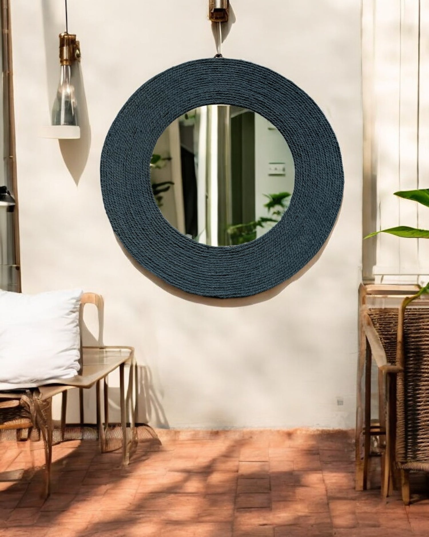 Close-up of Blue Haze rope mirror in outdoor patio setting highlighting its texture and form