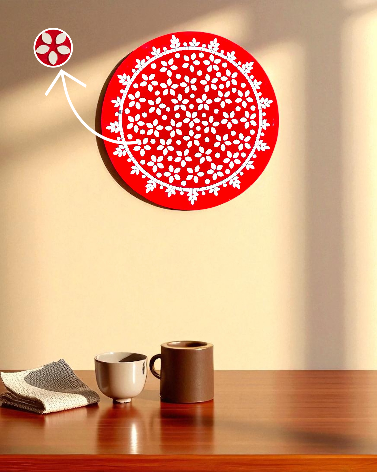Mirroza crimson bloom and white circular wall art on a beige wall with two cups on a wooden surface.
