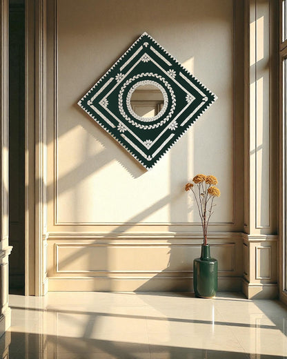 Emerald prism mirror mosaic wall hanging displayed on a beige wall near the window