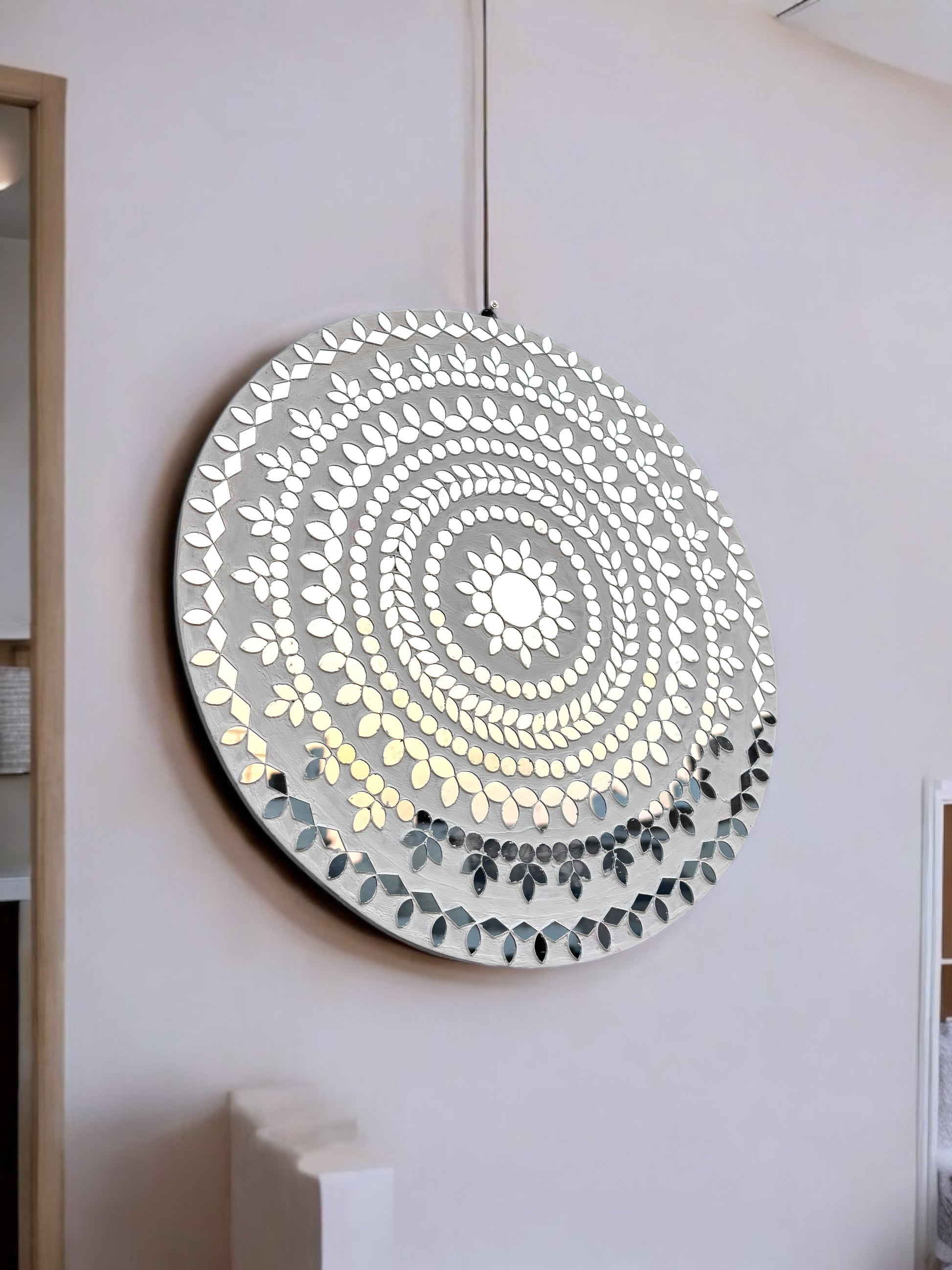 close-up view of white handcrafted mosaic mirror art with floral pattern by Mirroza