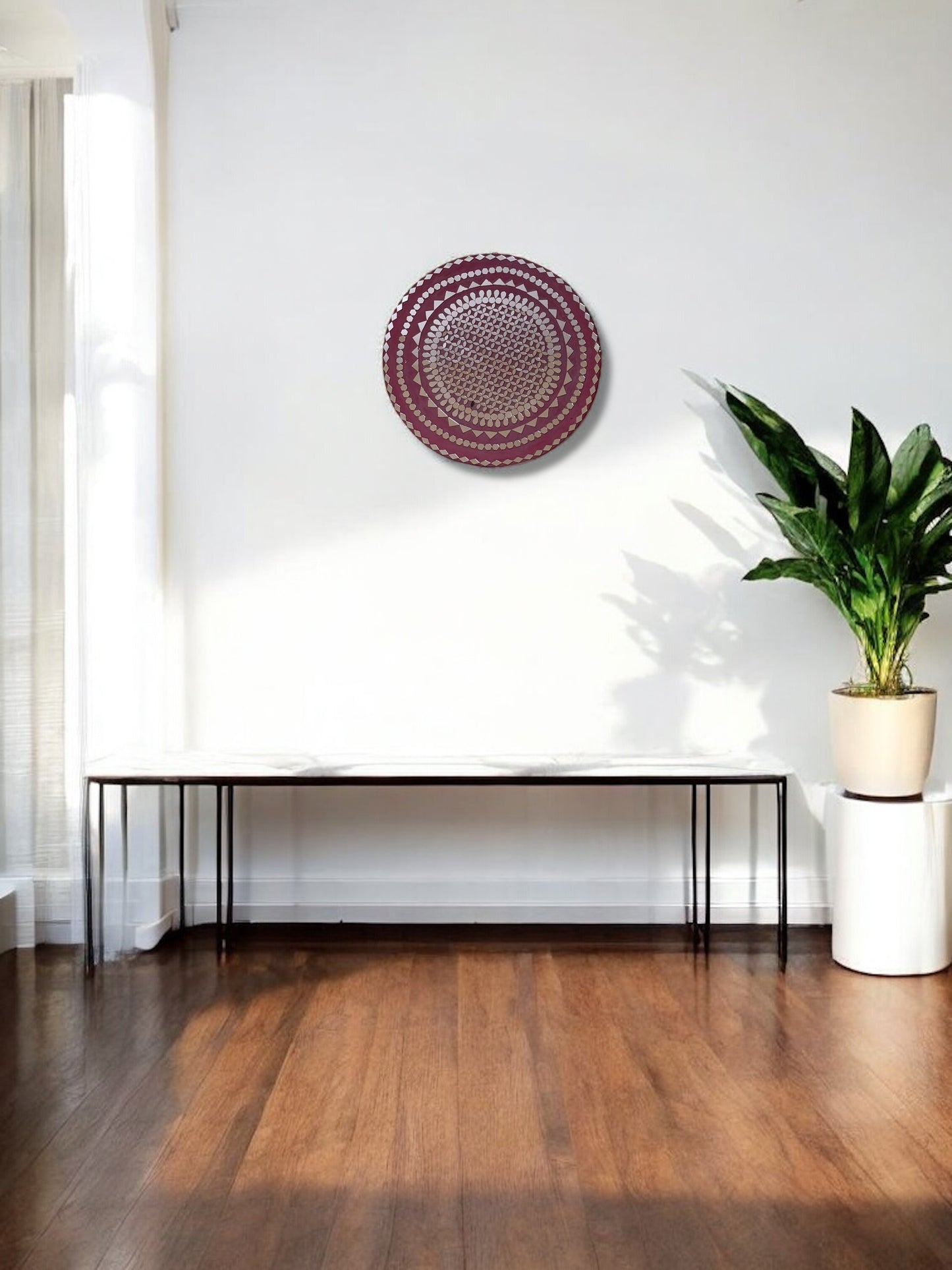 Raspberry mosaic wall mirror by Mirroza above a wooden console table with indoor plant decor.