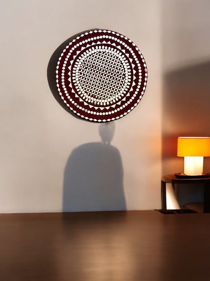 Raspberry mosaic mirror wall art by Mirroza hanging on a beige wall with wooden floor.