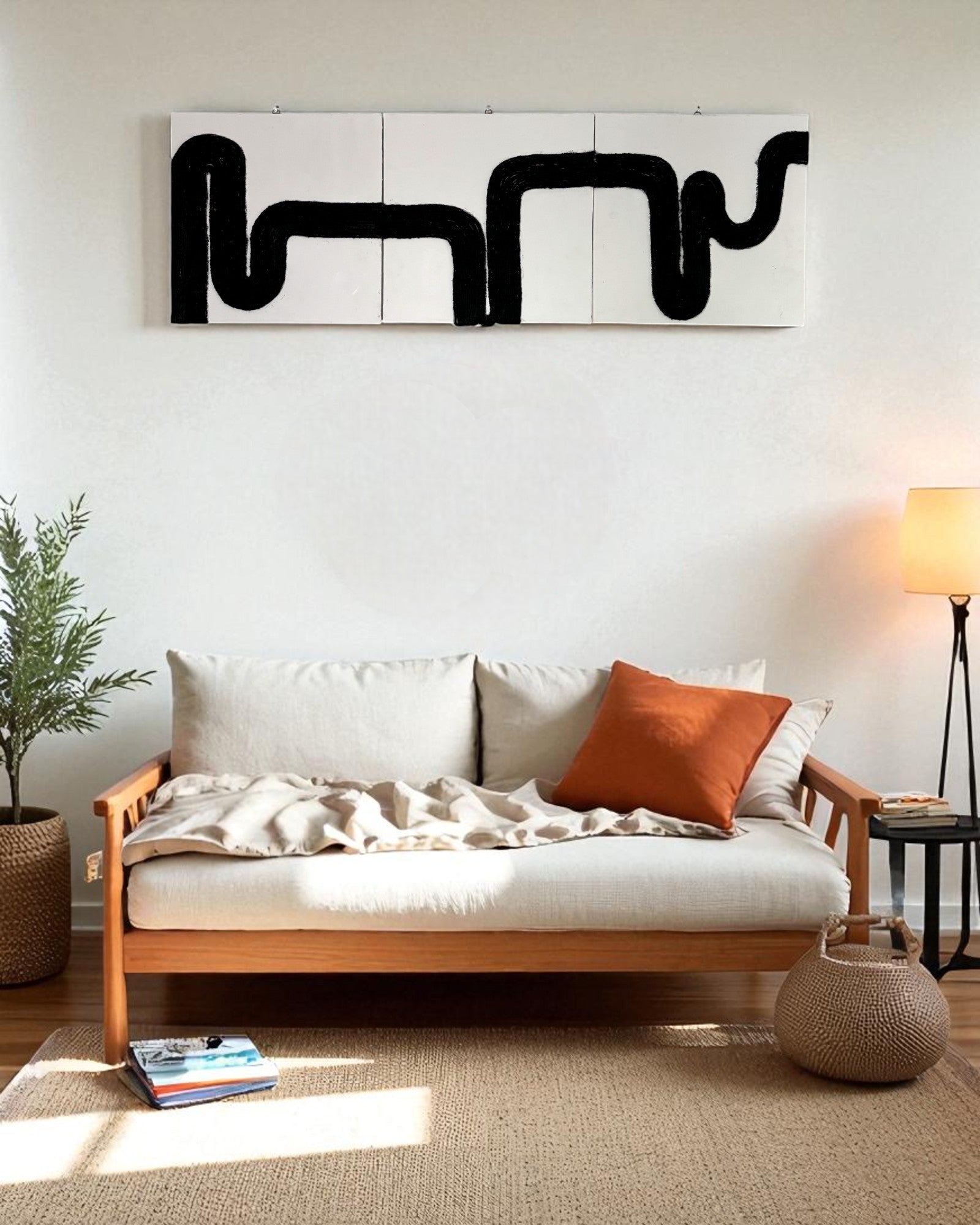 Minimalist boho space with black rope wall art above a beige wall, complemented by indoor plants and light wood accents.