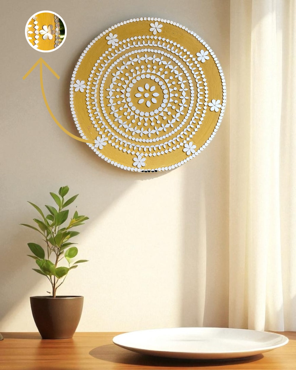 Mirroza mirror mosaic decorative wall art with circular pattern on a beige wall, plant, and plate on a table.
